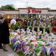Vice President Kamala Harris and her husband Doug Emhoff visit a memorial near the site of the Buffalo supermarket shooting after attending a memorial service for Ruth Whitfield, one of the victims of the shooting, Saturday, May 28, 2022, in Buffalo, N.Y.
